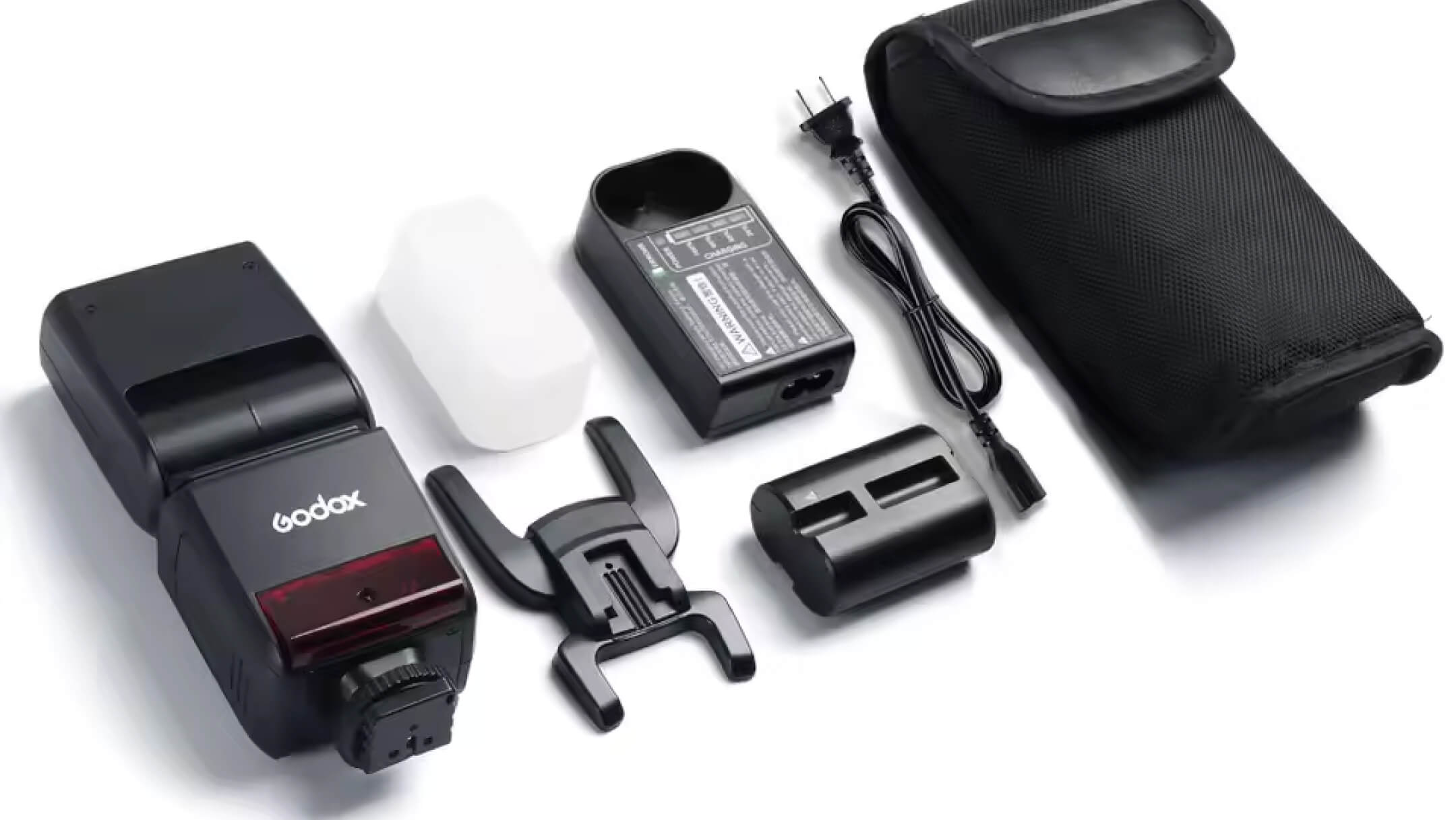 Комплект поставки вспышки Godox V350 с аккумулятором VB20, зарядным блоком, сетевым кабелем, рассеивателем, подставкой и чехлом